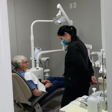 Dentist treating the patient at Village Dental - Ridgefield Park, NJ